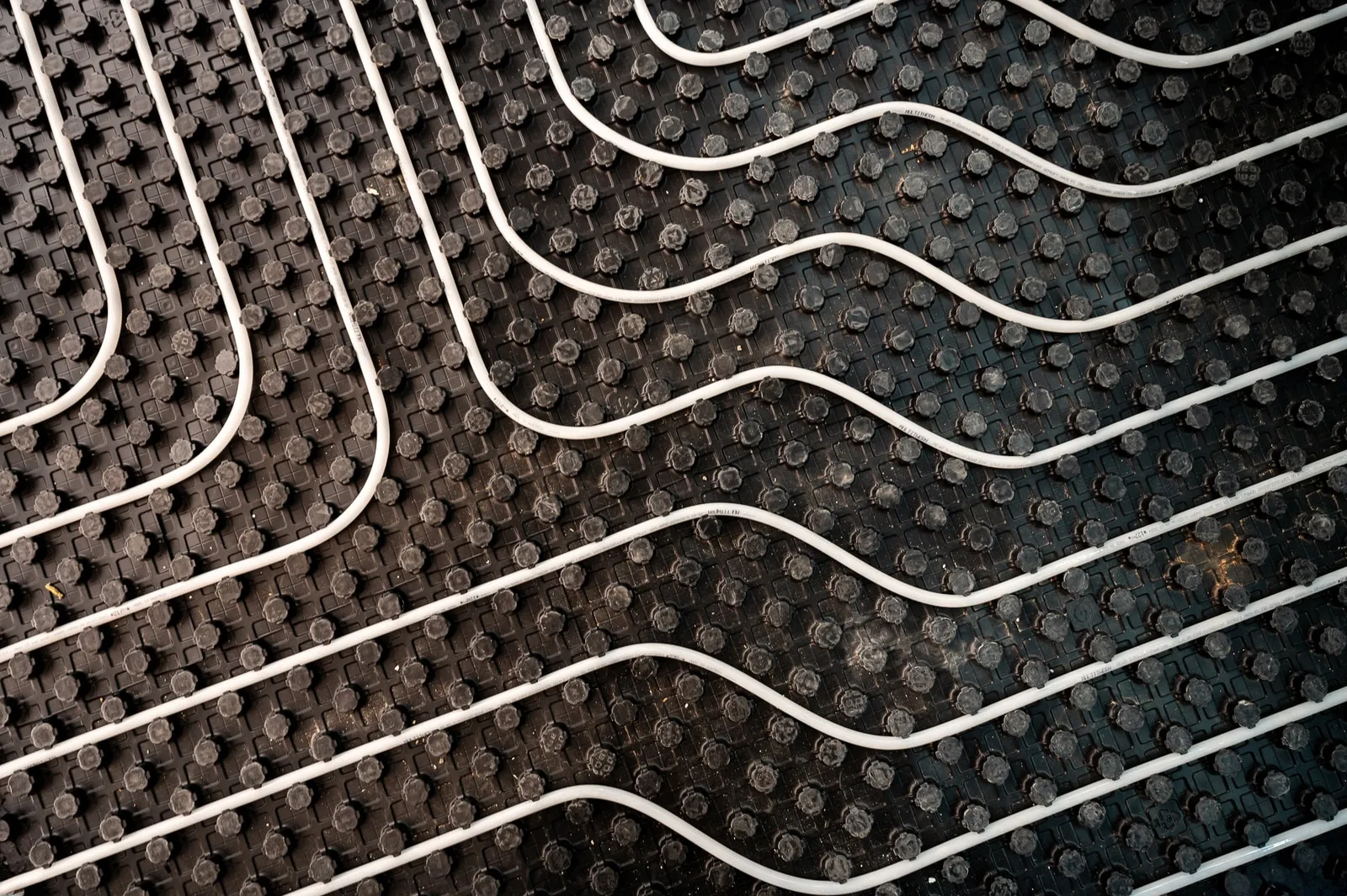 Heating pipes on studded panels – Foto Arsenal Wien construction site, July 2024